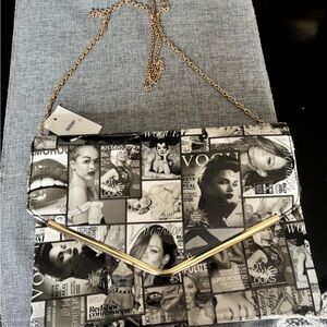 Elegant Black and White Graphic Vogue Magazine Clutch Purse with Gold Strap.